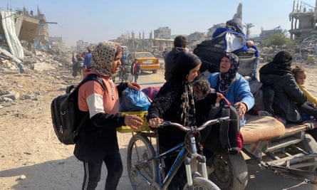 Palestinians fleeing Israeli attacks in Beit Hanoun, northern Gaza Strip, 12 November 2024