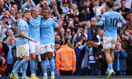 Erling Haaland is congratulated by his Manchester City teammates after making it 1-0 against Brighton.