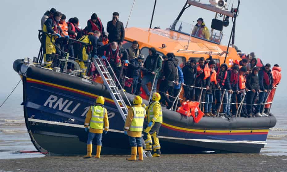 A group of people thought to be migrants are brought in to Dungeness, Kent, onboard the RNLI Lifeboat following a small boat incident in the Channel in March this year.