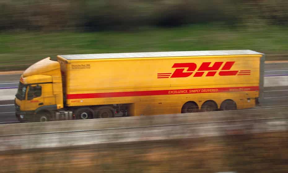 A DHL container lorry drives on the M1 motorway in Britain