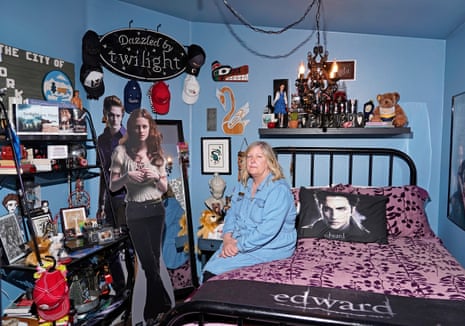 Lissy Andros in one of her home’s two Twilight-themed rooms. Twilight paraphernalia, including a cardboard cutout of the characters, an Edward pillow, and other material, is around the room