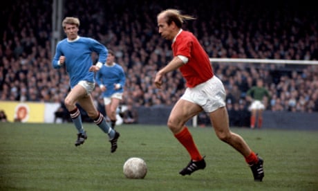 Bobby Charlton in action for Manchester United at Manchester City.