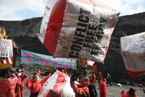 Banners and slogans against fossil fuels adorned inflated balloons.