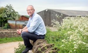 Robert Llewellyn at the barn in Temple Guiting where solar panels are to be installed.