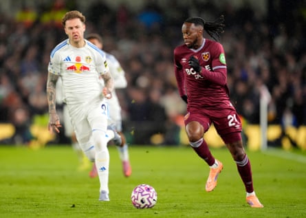 Aaron Wan-Bissaka (right) and Leeds’ Joe Rodon battle for the ball