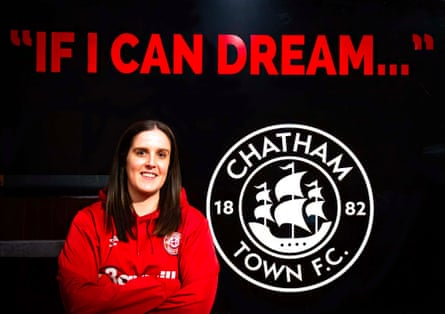 Chatham Town’s co-captain Grace Coombs in front of an 'If I can dream' sign at the stadium