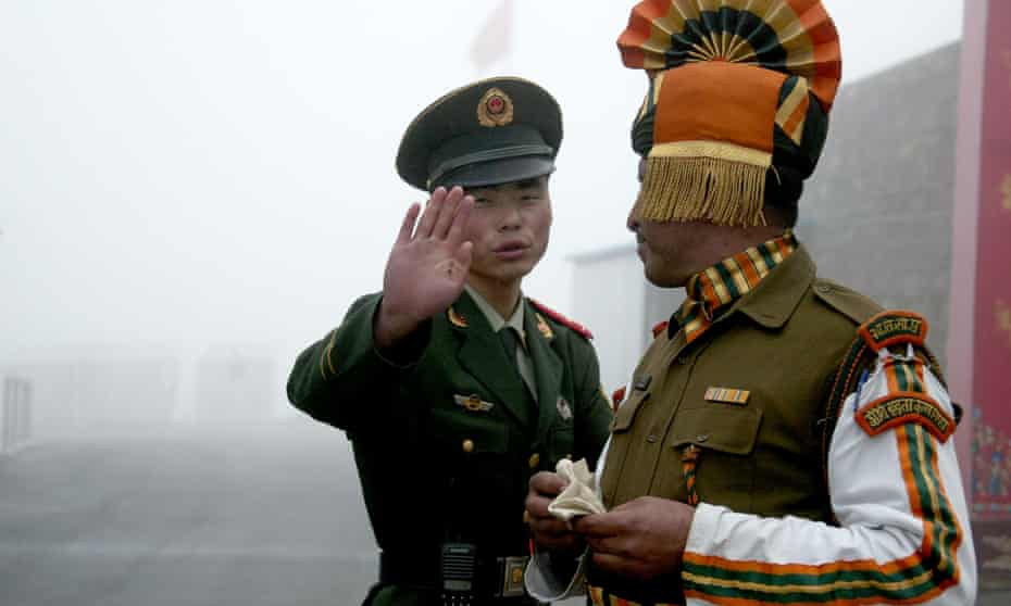 A Chinese and an Indian soldier at the Nathu La border crossing in India’s north-eastern Sikkim state in 2008.