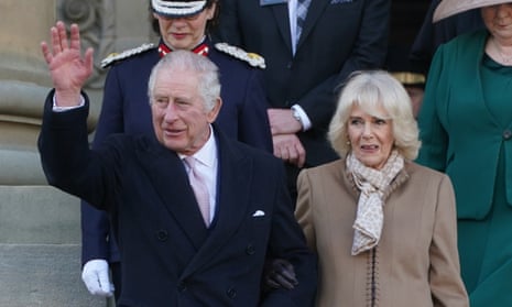 King Charles waves next to Camilla, the Queen Consort