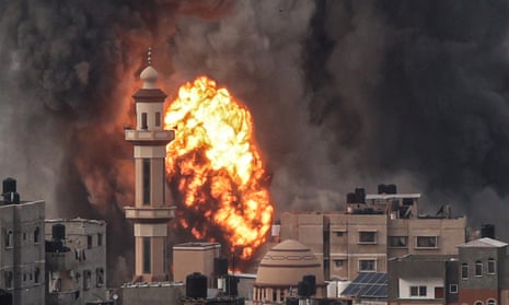 A fireball erupts over Rafah in the southern Gaza Strip amid continued Israeli bombing.