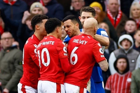 Gibbs-White clashes with Everton's McNeil.