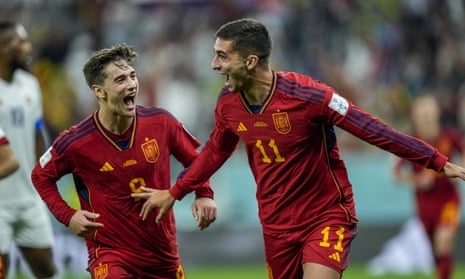 Spain's Ferran Torres, right, celebrates after scoring his side's fourth goal.