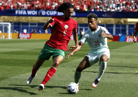 Ayyoub Bouaddi is tackled by Desire Doue.