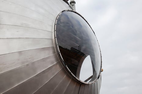 Close up of a round porthole window in an external wall