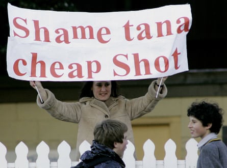 Lions fan Julie Richards holds up a banner in protest against Tana Umaga at an open training session