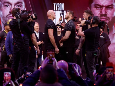 Tyson Fury (left) and Arslanbek Makhmudov face off at the weigh-in.