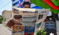 A man reads a newspaper with a front-page report on the crash of the Iranian president's helicopter outside a kiosk in Tehran on 20 May.