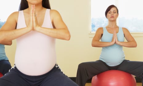 Pregnant women meditating on exercise balls