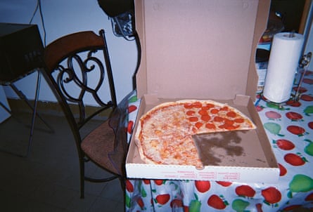 A box with a slice of pizza missing from the entire pie.