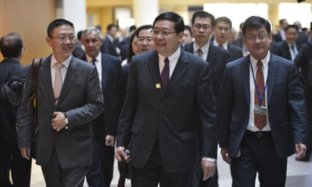 Lou Jiwei, centre, arrives for a G20 finance ministers’ and central bank governors’ meeting at the IMF on 15 April.
