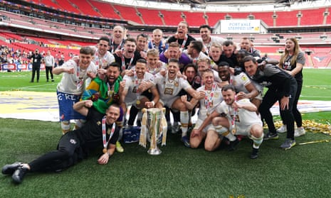 Port Vale celebrate after securing promotion to League One at Wembley.