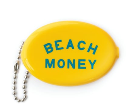 A yellow coin pouch with “beach money” written on it in blue