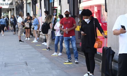 Keep your distance: shoppers on Oxford Street as Primark and Selfridges re-open after lockdown.