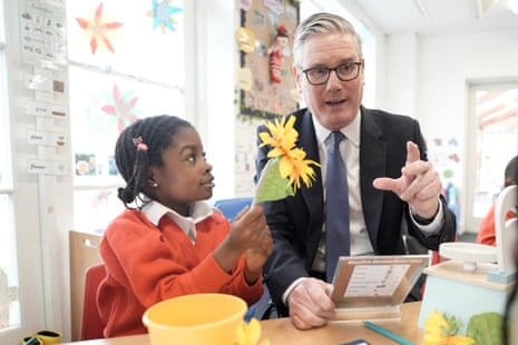 Keir Starmer with a pupil during a visit to St Paul's Church of England Primary School in south-east London