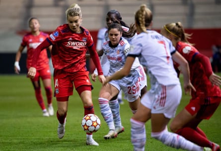 Lyon’s Ada Hegerberg surges past Bayern Munich’s Sarah Zadrazil during their Champions League group game in November 2021
