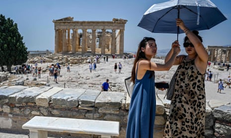 The sun shines on tourists visiting the Acropolis in Athens but a cloud hangs over Greek politics