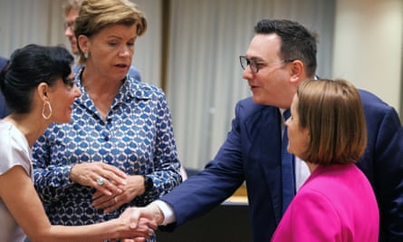 Lipavský, wearing a blue suit, reaches forward to shake hands with Lahbib, as Braže and Odobescu stand at either side