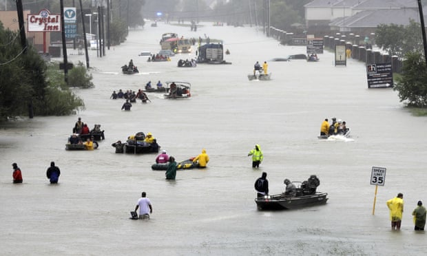 Flood evacueesFILE - In this Aug. 28, 2017, file photo, rescue boats float on a flooded street as people are evacuated from rising floodwaters brought on by Tropical Storm Harvey in Houston. Scientists say climate change is faster, more extensive and worse than they thought a quarter century ago. They’ve concluded climate change has caused more rain in hurricanes Harvey, Maria, Katrina and others. (AP Photo/David J. Phillip, File)