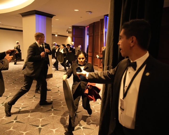 Chaos as Trump whisked from Washington press dinner after shots fired – in pictures