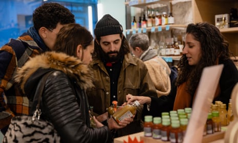 Customers look at alcohol-free drinks at Le Paon qui Boit in Paris.