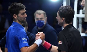 Novak Djokovic congratulates Dominic Thiem at the end of their three-hour fight