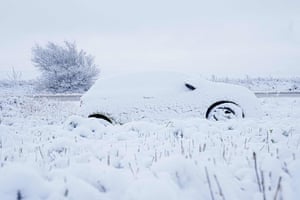 Jutland, Denmark: Snow covers a car