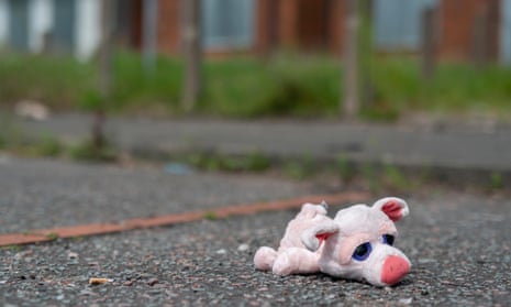 A child's toy on the ground outside boarded-up houses in Pendleton, Salford.
