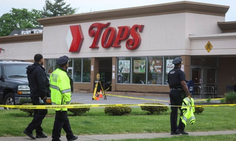 Members of the Buffalo police department work at the scene of a shooting at a Tops supermarket.