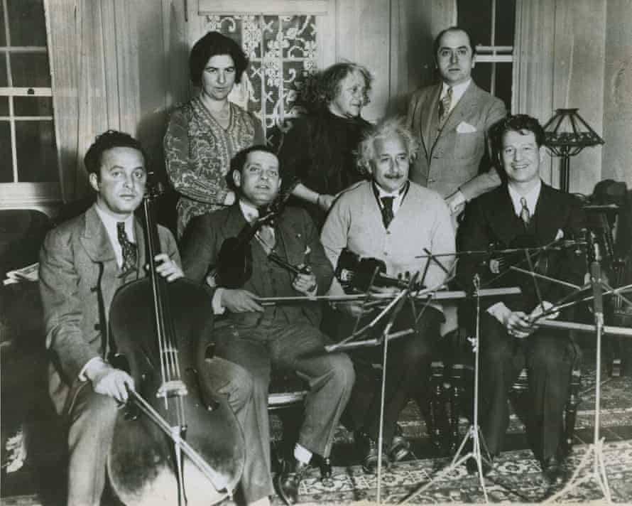 Einstein and the fellow members of the string quartet meet to practice for a concert at the Hotel Waldorf-Astoria (concert date: December 15, 1933) to raise money for German-Jewish refugees. From left to right, sitting: Arthur (Ossip) Giskin, Toscha Seidel, Albert Einstein, and Bernard Ocko; standing: Mrs. Seidel, Elsa Einstein, and unidentified man.