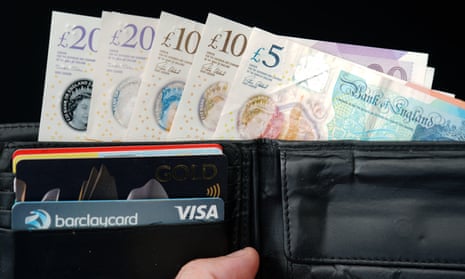 £5, £10, £20 notes and credit cards in a wallet