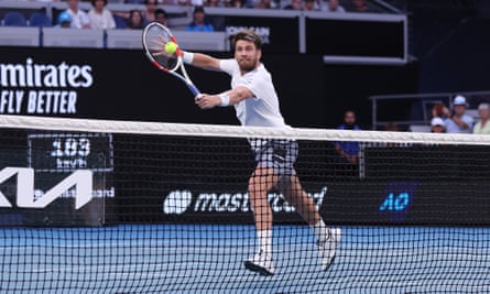 Cameron Norrie stretches for a backhand volley on the way to his third-round victory over Casper Ruud.