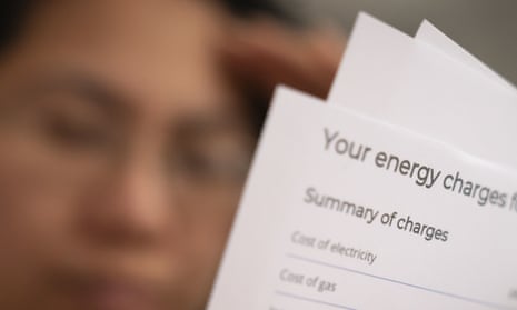 Stressed woman reading energy bills