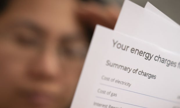 Distressed-looking person reads energy bill