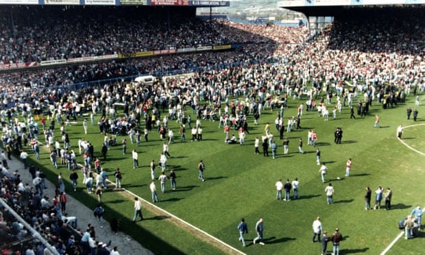 Thousands of fans on the pitch during the FA Cup semi-final at Hillsborough in April 1989