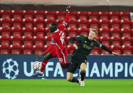 Liverpool’s Sadio Mane is fouled by Ajax’s Perr Schuurs .