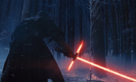 Kylo Ren with his lightsaber in a scene from Star Wars: The Force Awakens.