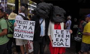 Anti-coal mining protesters join thousands in Sydney on 24 March.