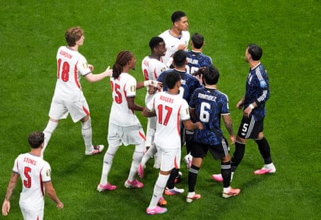 England's Jude Bellingham clashes with Argentina's Leandro Paredes after a challenge on Elliot Anderson.