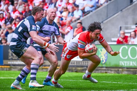 Jake Davies scores a try for St Helens.