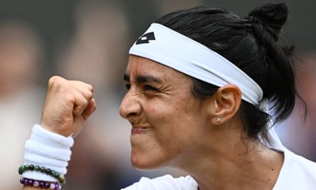 Ons Jabeur celebrates beating Elena Rybakina in their women’s singles quarter-final at Wimbledon.