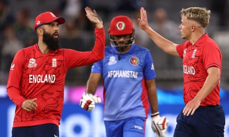 England’s Moeen Ali and Sam Curran (right) celebrate the wicket of Rashid Khan of Afghanistan.